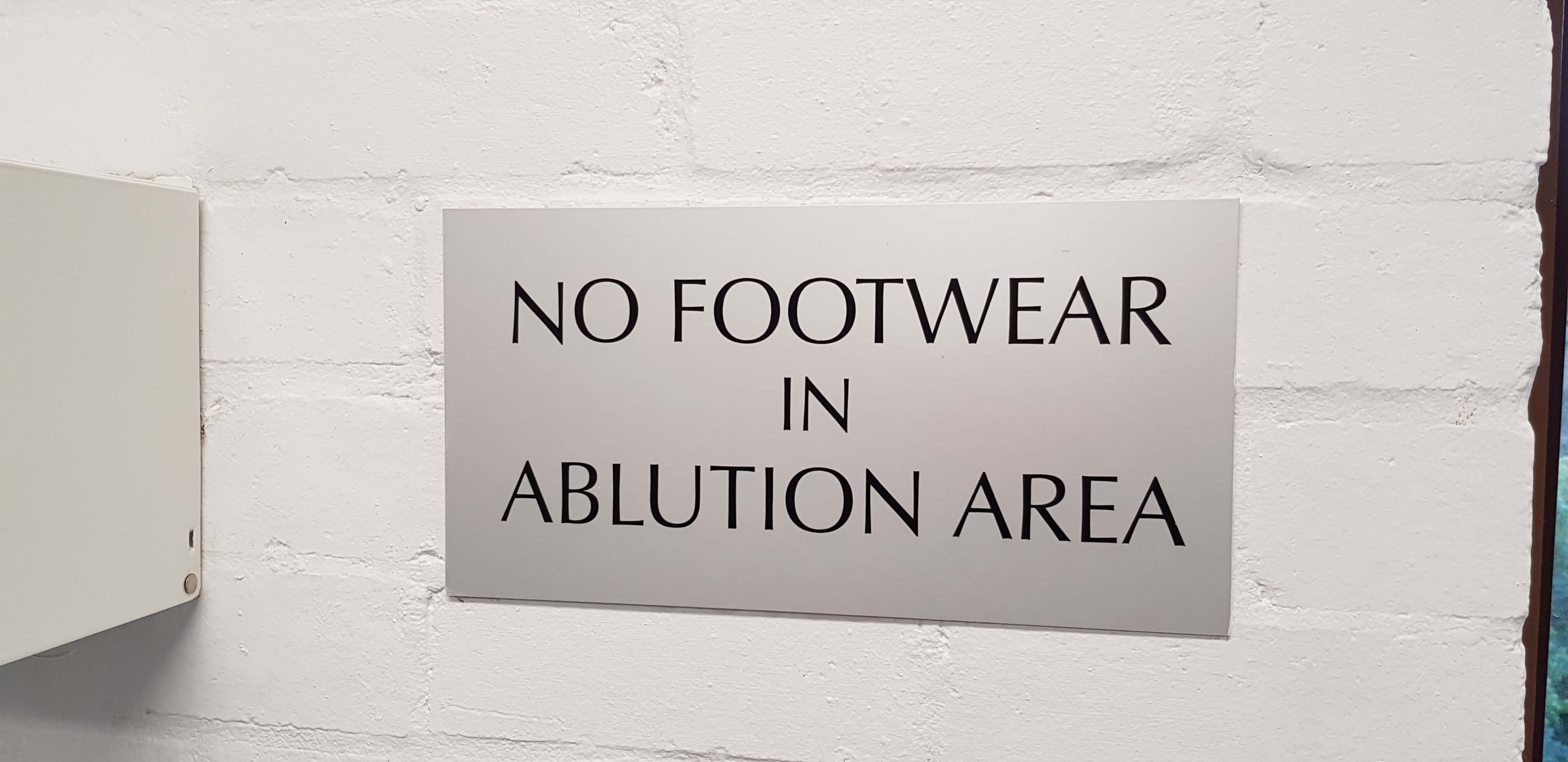 Brother's Wudu Area at ISOC UNSW - No footwear in the ablution area sign